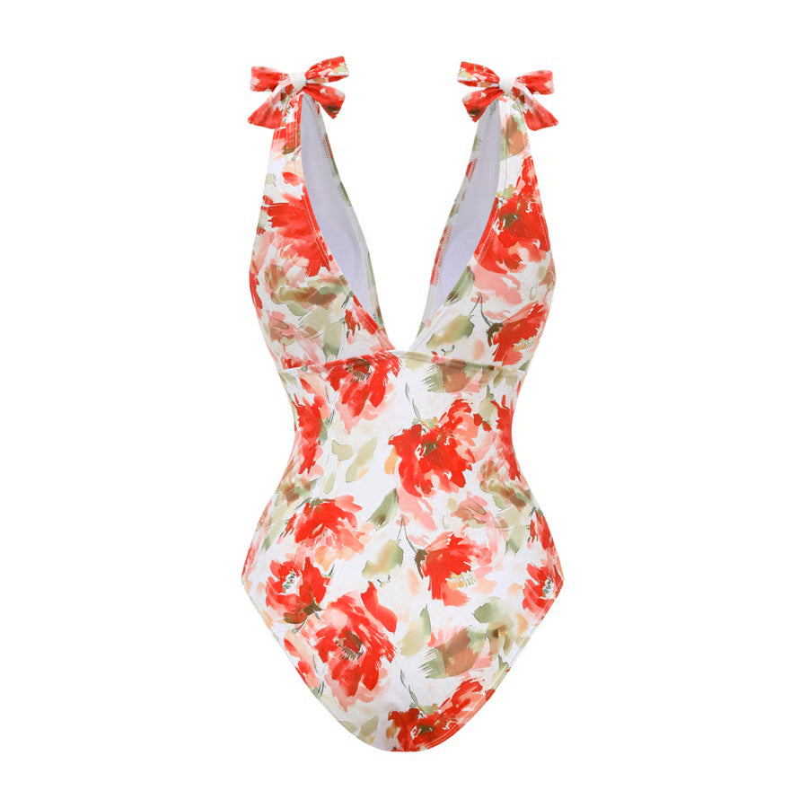 Bañador Rosavelle crudo y rojo con estampado floral, escote en V y falda