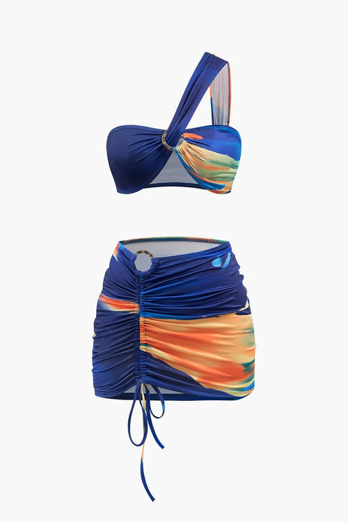 Bikini Azoria asimétrico estampado azul marino y naranja con falda